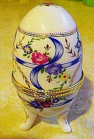 Pretty porcelain egg trinket box with ribbons and roses