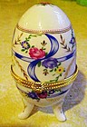Pretty porcelain egg trinket box with ribbons and roses