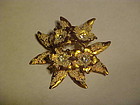 Goldtone flower pin with rhinestones AUSTRIA