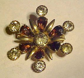 Vintage snowflake style rhinestone pin with purple