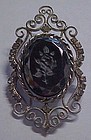 Rhinestine pin with black carved rose center