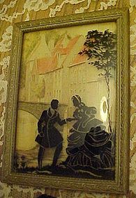 Courting couple framed silhouette convex glass