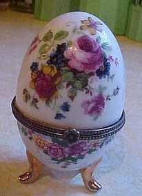 Pretty porcelain egg hinged trinket box on three feet