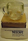 Vintage Nescafe glass coffee mug premiums world etched
