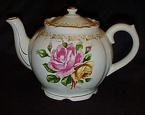 Lovely vintage porcelain teapot with pink yellow roses