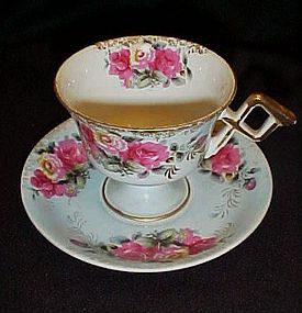 Vintage footed tea cup and saucer set Hand painted