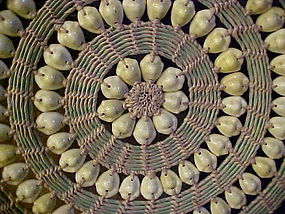 Vintage woven lidded basket with cowrie shells