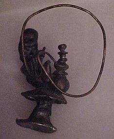 Pewter Genie man smoking a hookah figurine on mushroom