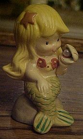 Vintage mermaid figurine with oyster and pearl