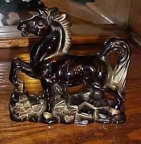 Vintage black and gold prancing horse figurine