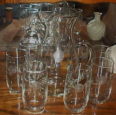 Hand blown pitcher and 8 glasses with cut rose pattern
