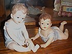 Large bisque Piano babies figurines pair