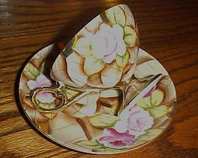 Vintage hand painted large rose chintz cup and saucer