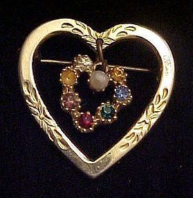 Gold tone heart pin with rhinestone dangle heart center