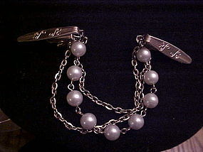 Vintage gold tone sweater guard with chains and pearls