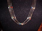 Four chain strand  necklace with semi precious beads