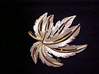 Beautiful vintage JJ goldtone and white maple leaf pin