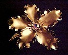 Vintage 1950's  gold tone flower pin rhinestone center