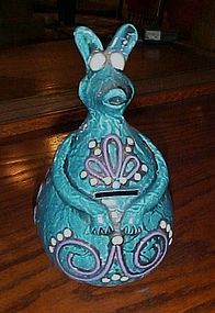 Groovy 70's turquoise kangaroo bank plaster ceramic or paper mache?