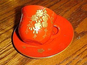 Occupied Japan Lacquer tea cup and saucer flowering vines red and gold