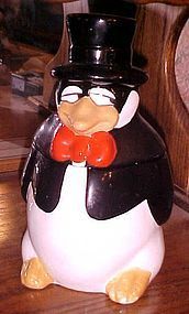 Vintage US sly penguin in top hat and tie cookie jar