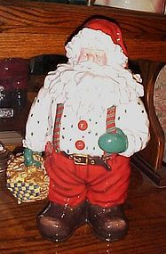 Santa Claus with basket of gingerbread men cookies, cookie jar