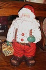 Santa Claus with basket of gingerbread men cookies, cookie jar