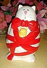 Christmas Kitty cat cookie jar wrapped in red ribbon and bow