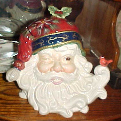 Santa Claus head cookie jar with red cardinal bird