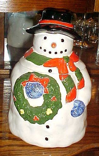 Festive Snowman holding wreath cookie jar