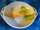 Nippon sailboat on lake at sunset serving bowl