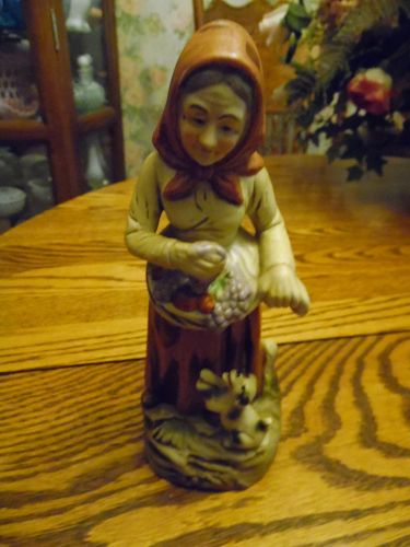 Homco style bisque porcelain lady with basket of apples and dog