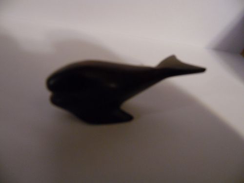 carved ironwood miniature whale figurine