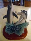 Dolphin duo breaching the waves figurine