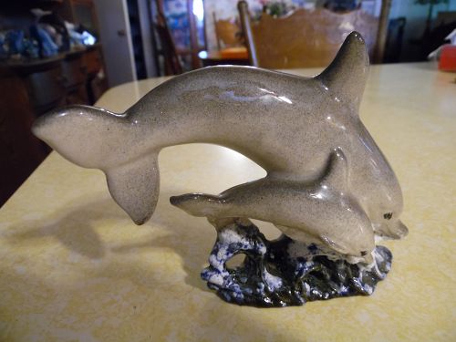 Ceramic dolphin and baby jumping ocean waves figurine