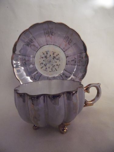 Lovely vintage Lustre ware teacup and saucer fancy three legs