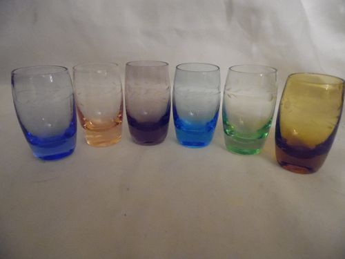 vintage set of colored shot glasses with cut design