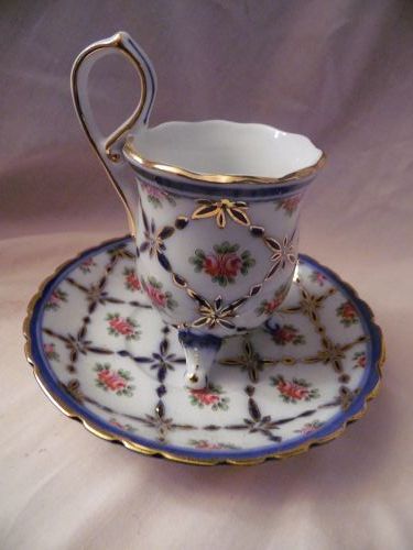 Limoges China fancy cup and saucer set with 3 feet
