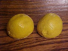 Old chalkware salt and pepper shakers, lemons