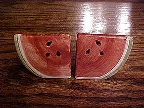 Watermelon slices, salt and pepper shakers