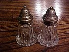 Fancy glass salt and pepper shakers, with plated tops