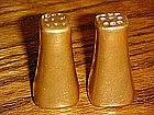 Small gold salt and pepper shakers