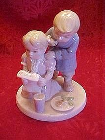 Lladro style children with note from Santa, figurine