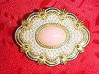Gold tone pin with pink center and seed pearls