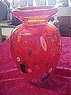 Orange art glass vase with milliflori, probably Murano