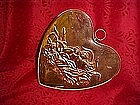 Copper heart mold with love birds in nest