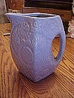 Old Niloak  pitcher , embossed floral, blue glaze