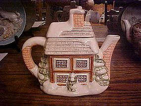 Snow covered house,  ceramic tea pot