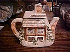 Snow covered house,  ceramic tea pot