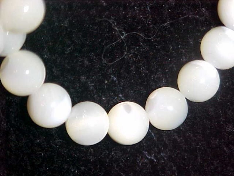 Solid mother of pearl strand of beads